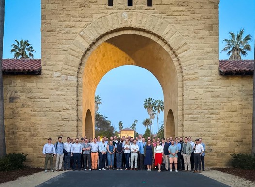Course members outside under a stone arch in San Francisco.