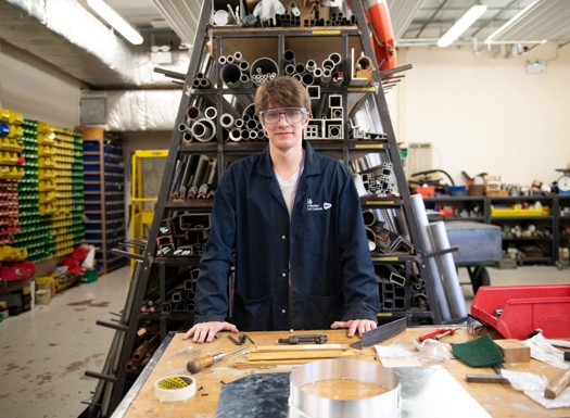 Young male DE&S apprentice in a workshop.
