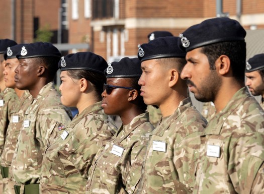Army cadet stood for inspection during parade.