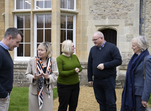 Peers and MPs having a group discussion outside Beckett House