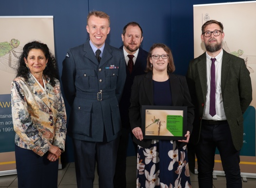 Technology Enhanced Learning team holding their joint 2nd place net zero certificate.